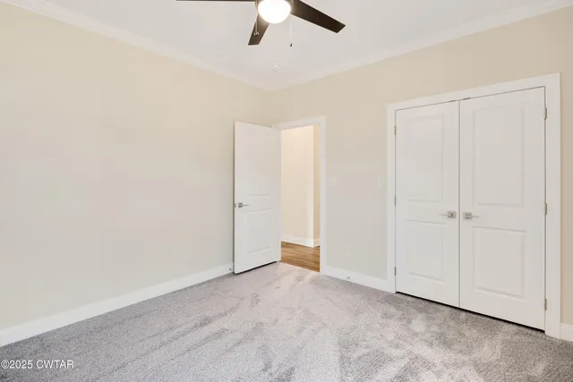 an empty room with fan