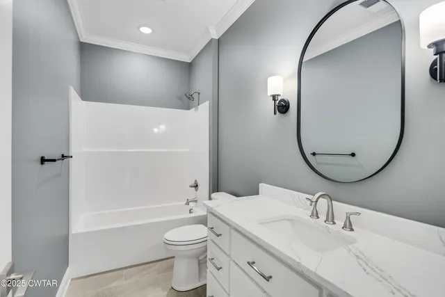 a bathroom with a toilet a sink and a mirror