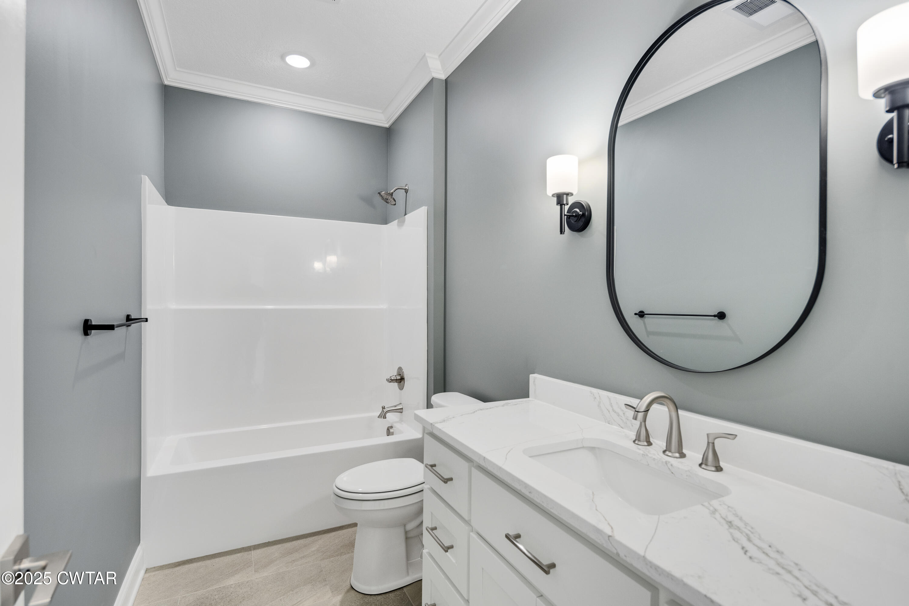 16 Enoch Cove Jackson, TN 38305 - Photo 25 of 28 a bathroom with a toilet a sink and a mirror