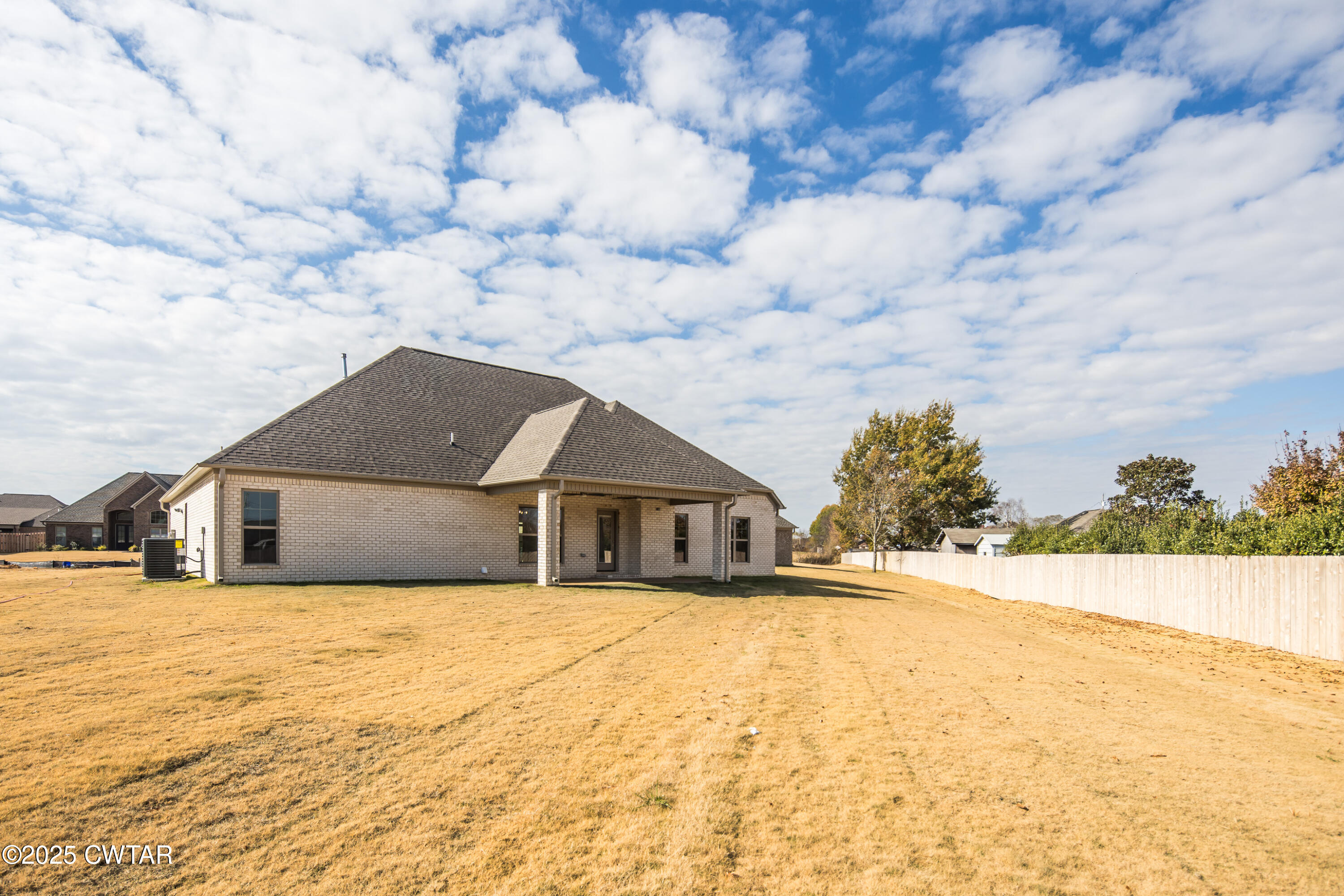 16 Enoch Cove Jackson, TN 38305 - Photo 27 of 28 a white house with a large tree in front of it