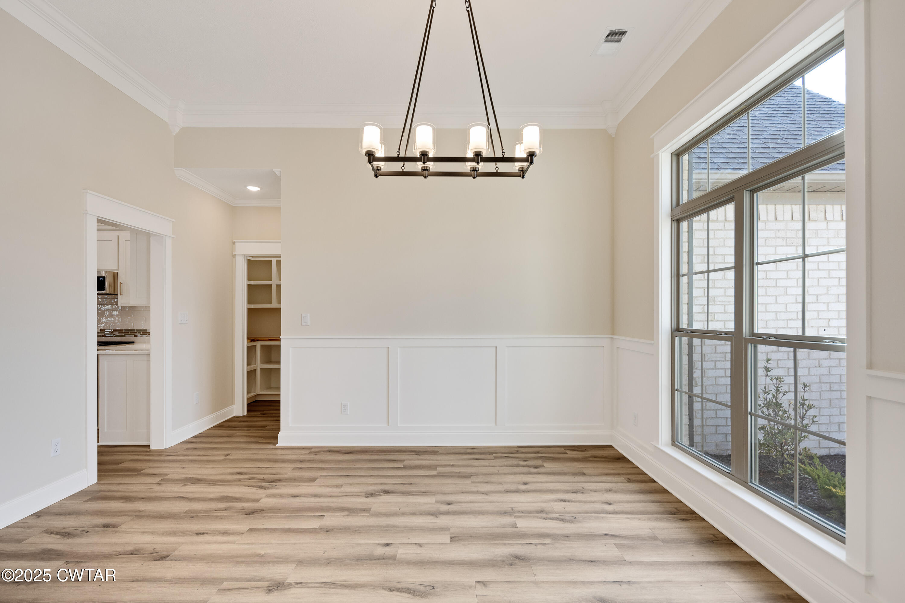 16 Enoch Cove Jackson, TN 38305 - Photo 5 of 28 a view of empty room with wooden floor and fan