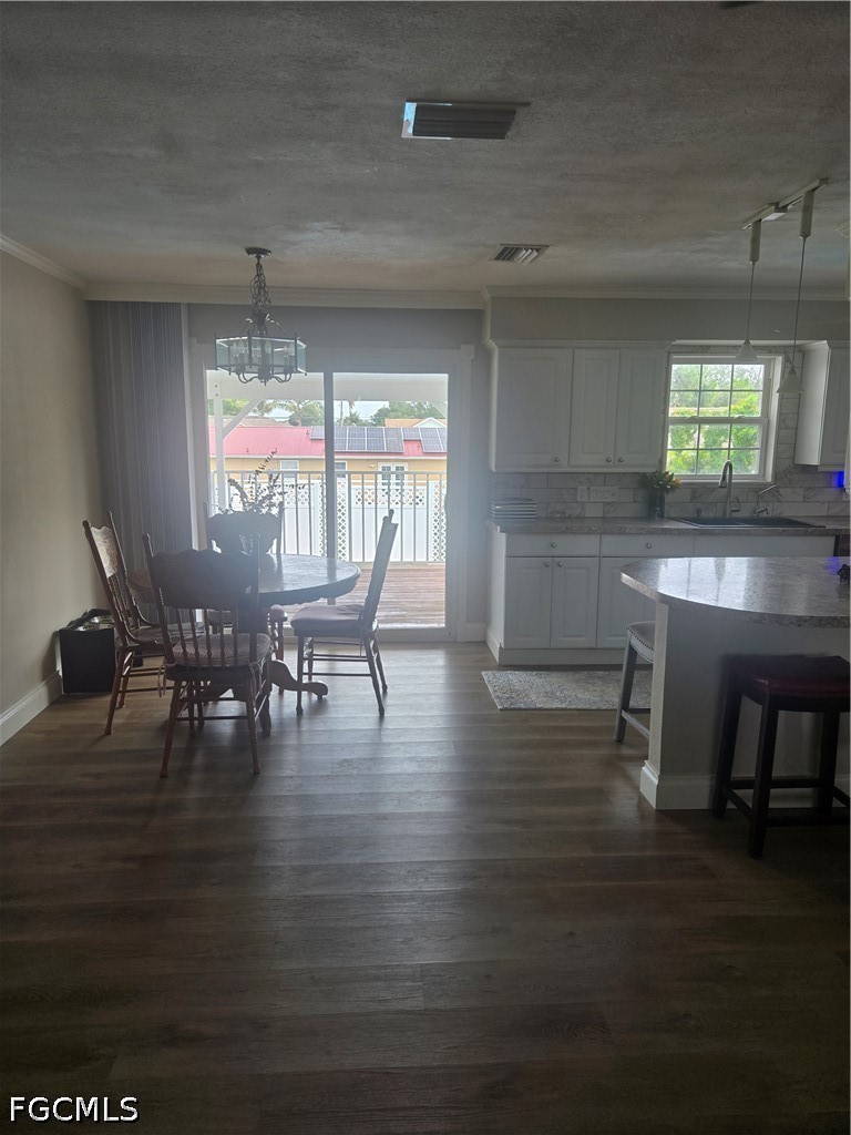 8093 Anhinga Road Fort Myers, FL 33967 - Photo 9 of 49 a dining room with furniture window and wooden floor