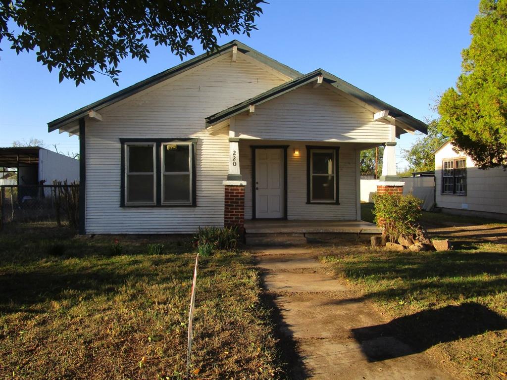a house with trees in the background
