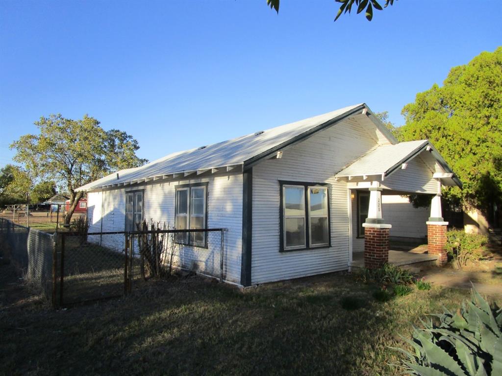 220 Southwest 5th Street Hamlin, TX 79520 - Photo 2 of 28 a view of a house with backyard porch and sitting area