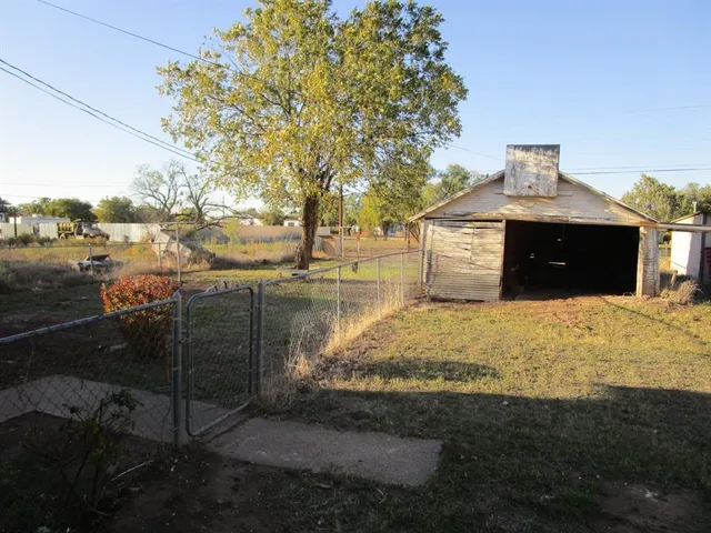 a view of a backyard of the house