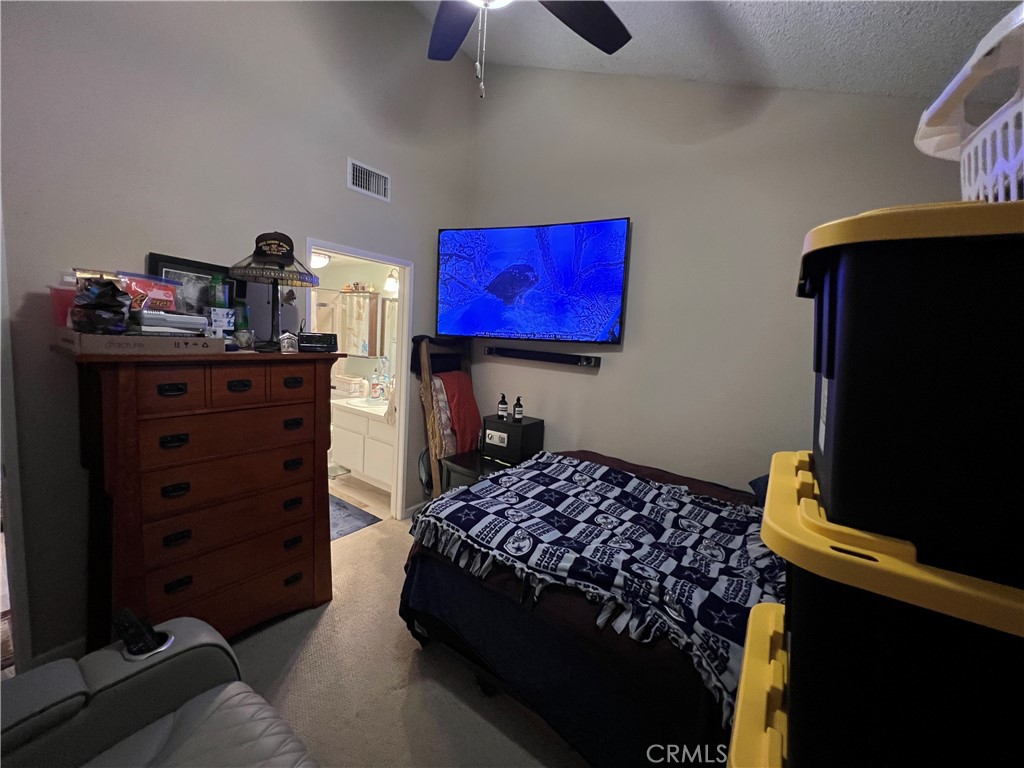 2733 Quail Ridge Circle, Unit 32 Fullerton, CA 92835 - Photo 15 of 25 a bedroom with a bed and flat screen tv
