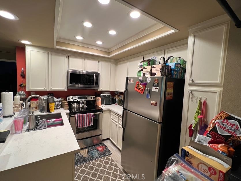 2733 Quail Ridge Circle, Unit 32 Fullerton, CA 92835 - Photo 8 of 25 a kitchen with a refrigerator and a sink