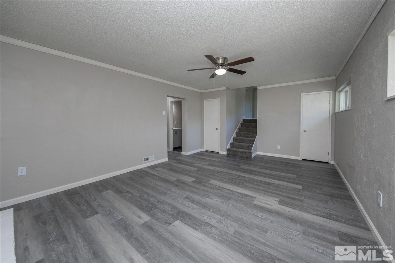1520 Surf Way Reno, NV 89503 - Photo 21 of 32 a view of empty room with wooden floor and ceiling fan