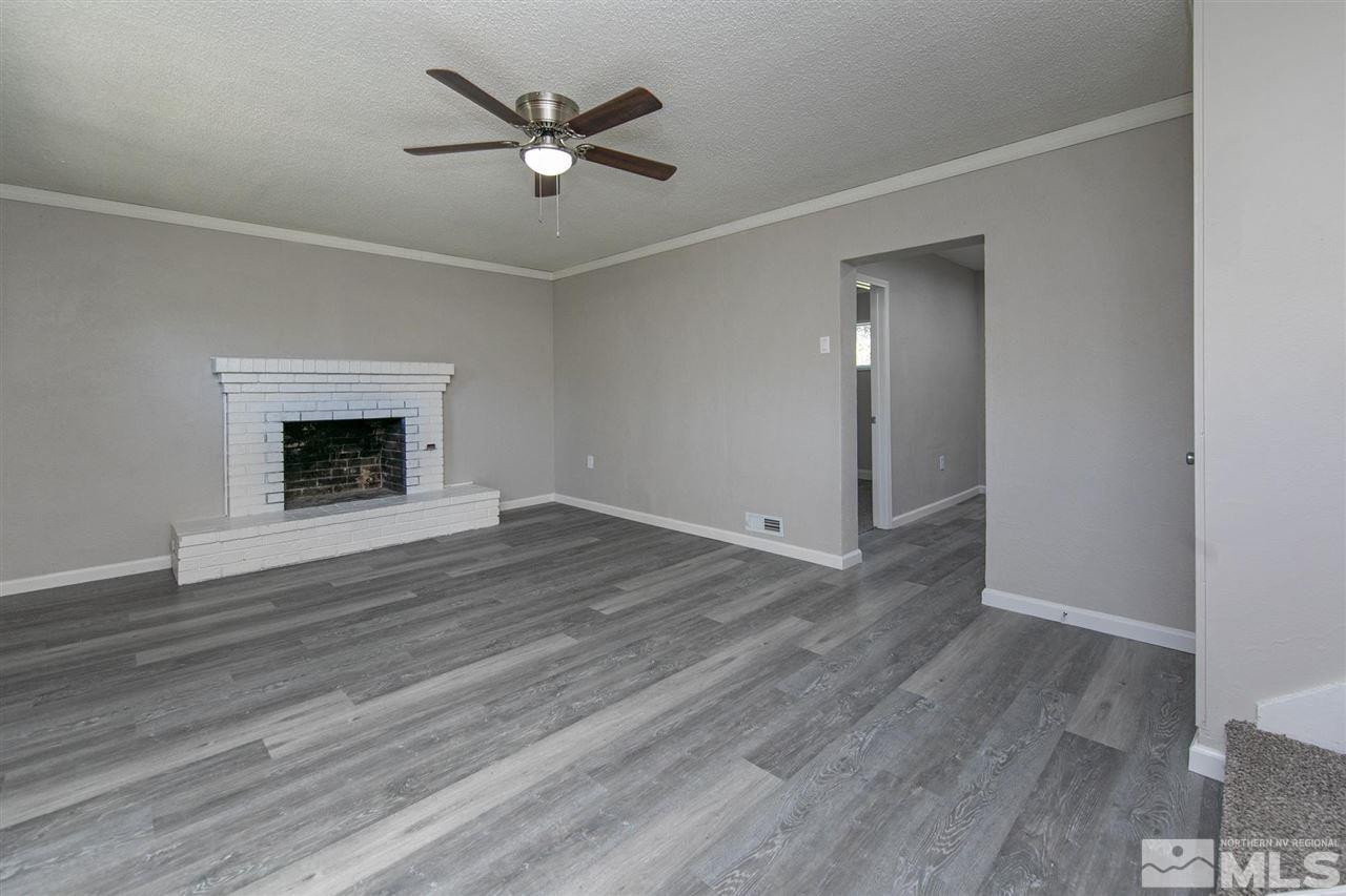 1520 Surf Way Reno, NV 89503 - Photo 23 of 32 an empty room with wooden floor and a ceiling fan