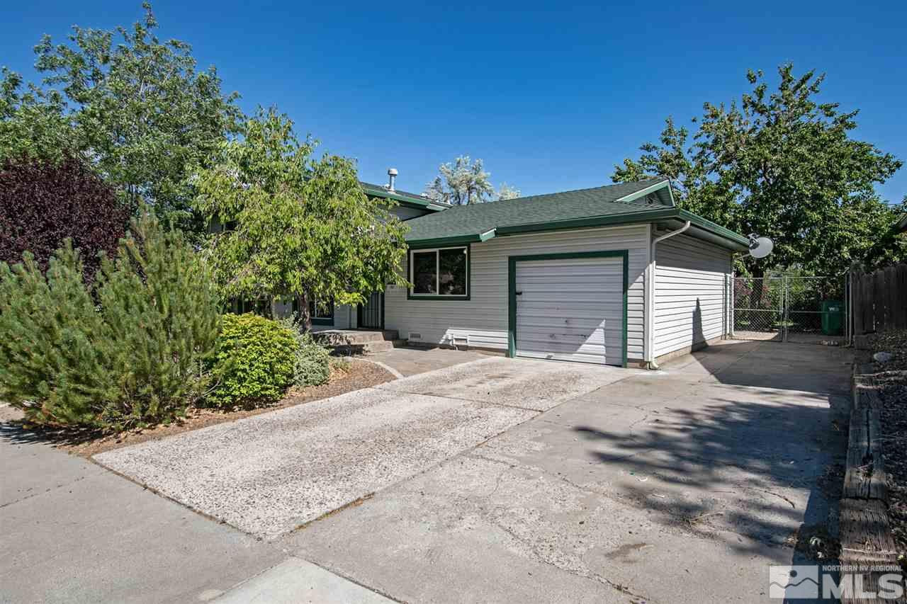 1520 Surf Way Reno, NV 89503 - Photo 4 of 32 a front view of a house with a yard