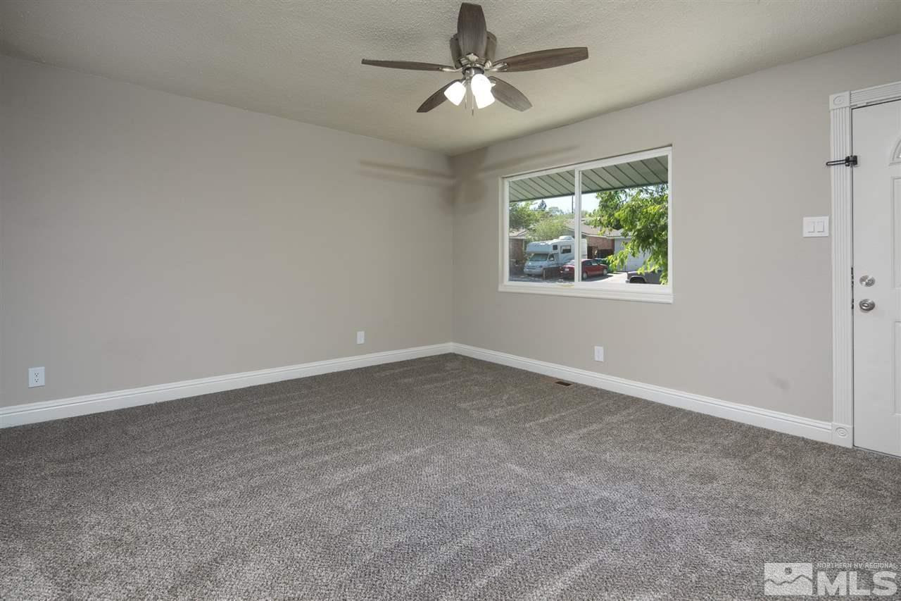1520 Surf Way Reno, NV 89503 - Photo 8 of 32 an empty room with windows and fan