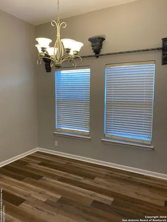 a view of a livingroom with wooden floor and fireplace