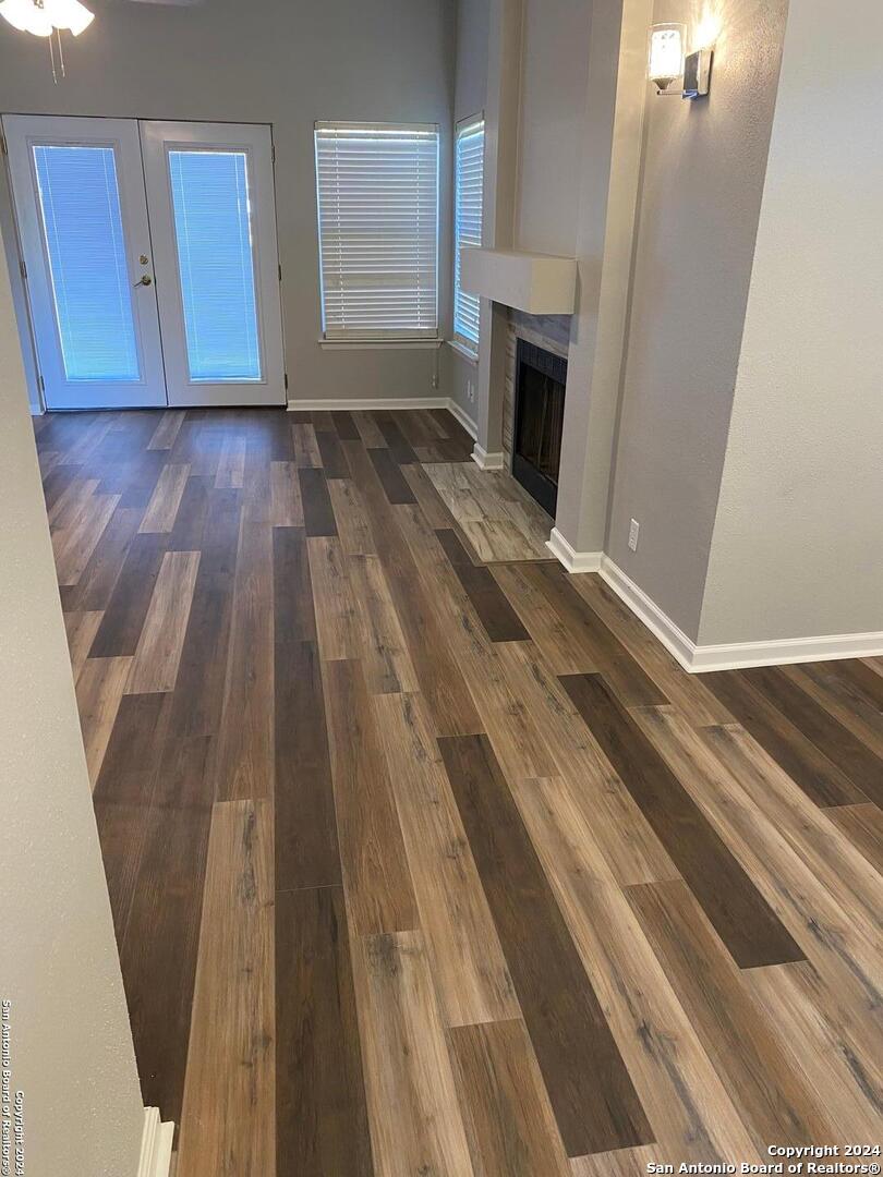 8404 Forest Ridge Drive San Antonio, TX 78239 - Photo 12 of 18 a view of a livingroom with wooden floor and fireplace