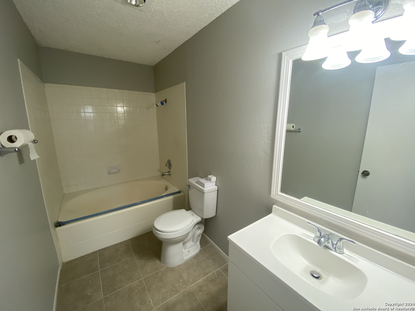 8404 Forest Ridge Drive San Antonio, TX 78239 - Photo 6 of 18 a bathroom with a sink toilet and shower