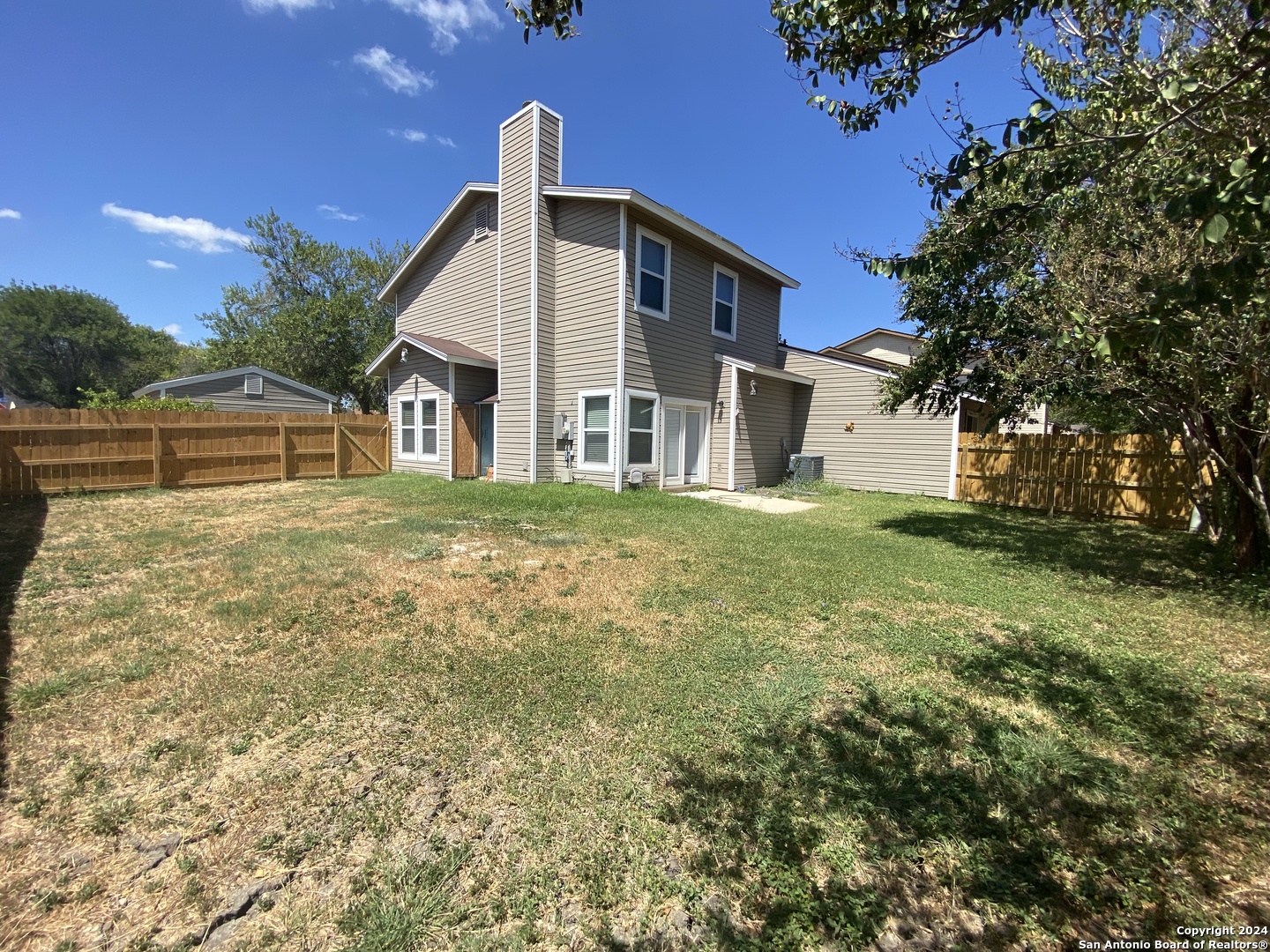 8404 Forest Ridge Drive San Antonio, TX 78239 - Photo 7 of 18 a front view of a house with a yard