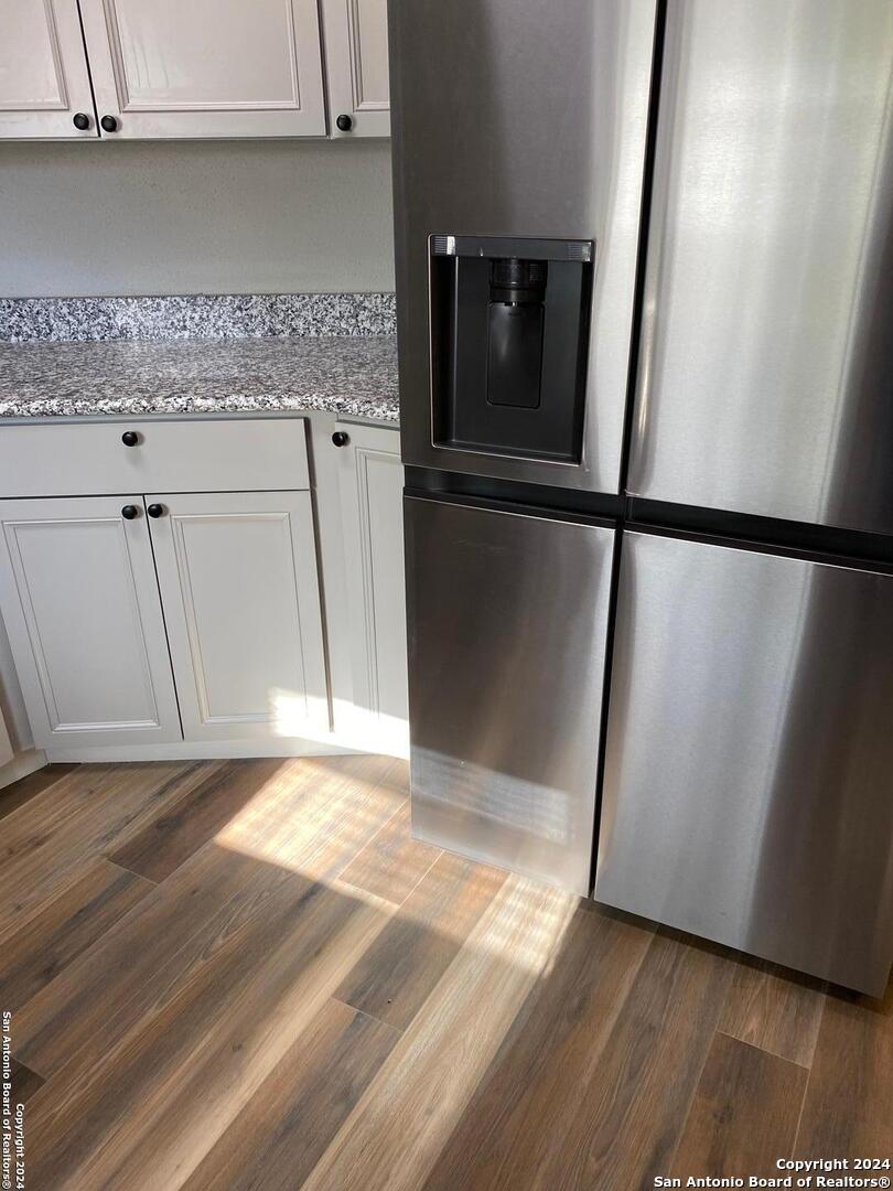 8404 Forest Ridge Drive San Antonio, TX 78239 - Photo 10 of 18 a view of a kitchen with a sink and a refrigerator
