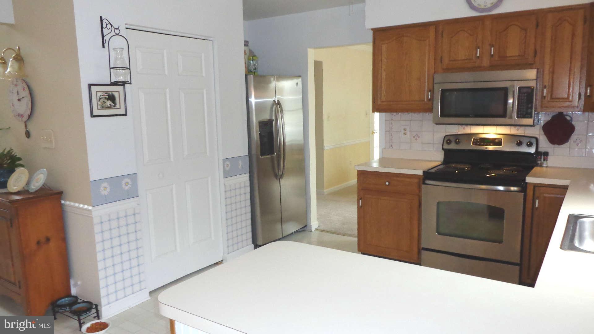 Large pantry and stainless steel appliances