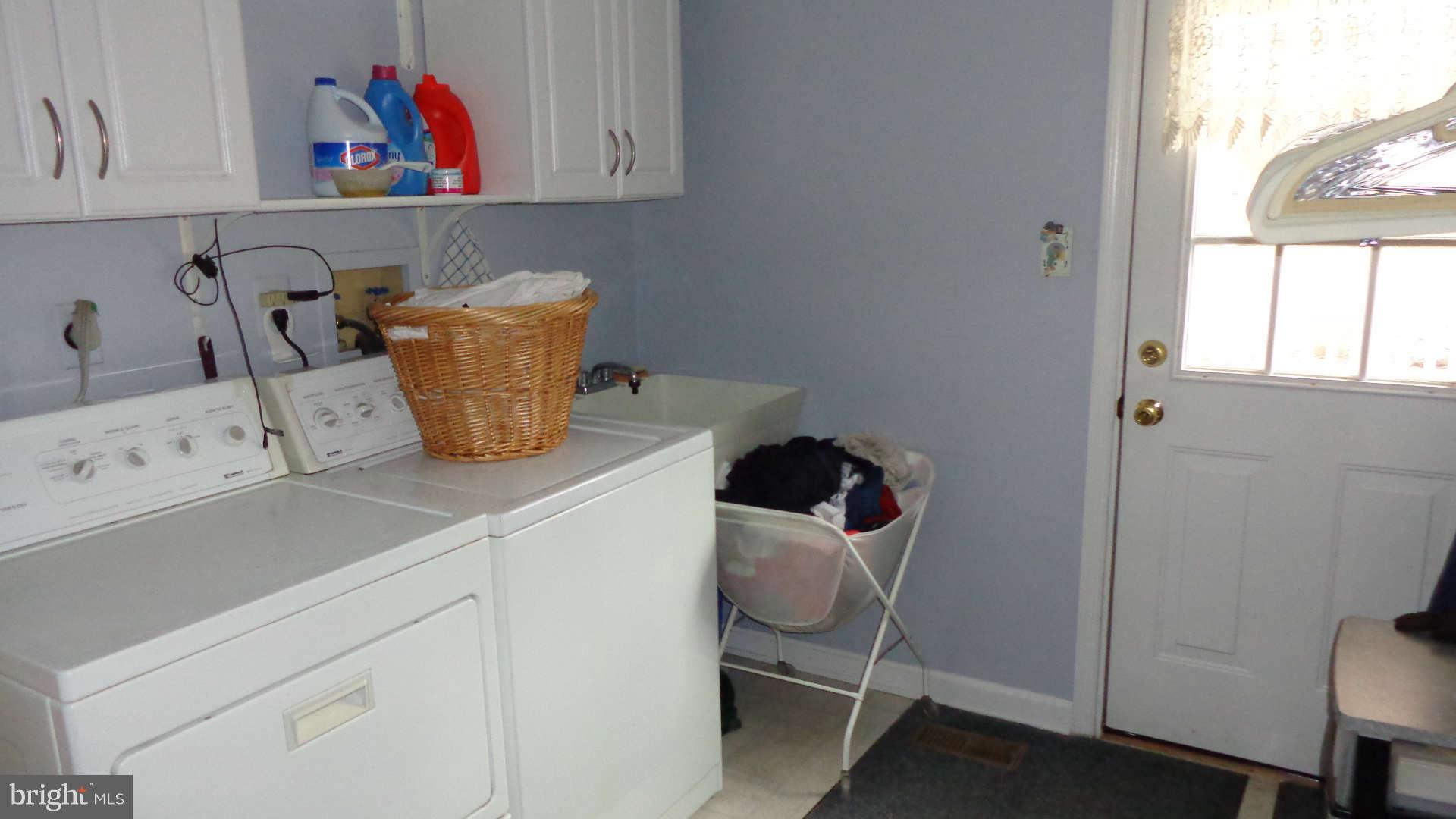 2520 Bear Run Road Taneytown, MD 21787 - Photo 10 of 28 Laundry room has storage cabinets and service door