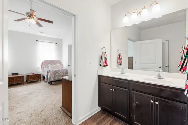 a en suite bathroom with a double vanity sink mirror and