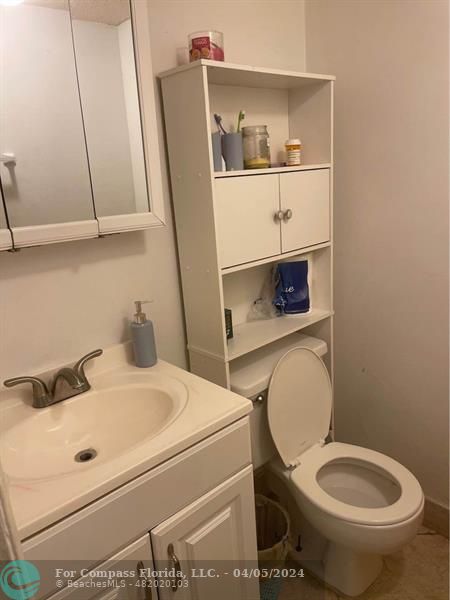 a bathroom with a toilet and a sink