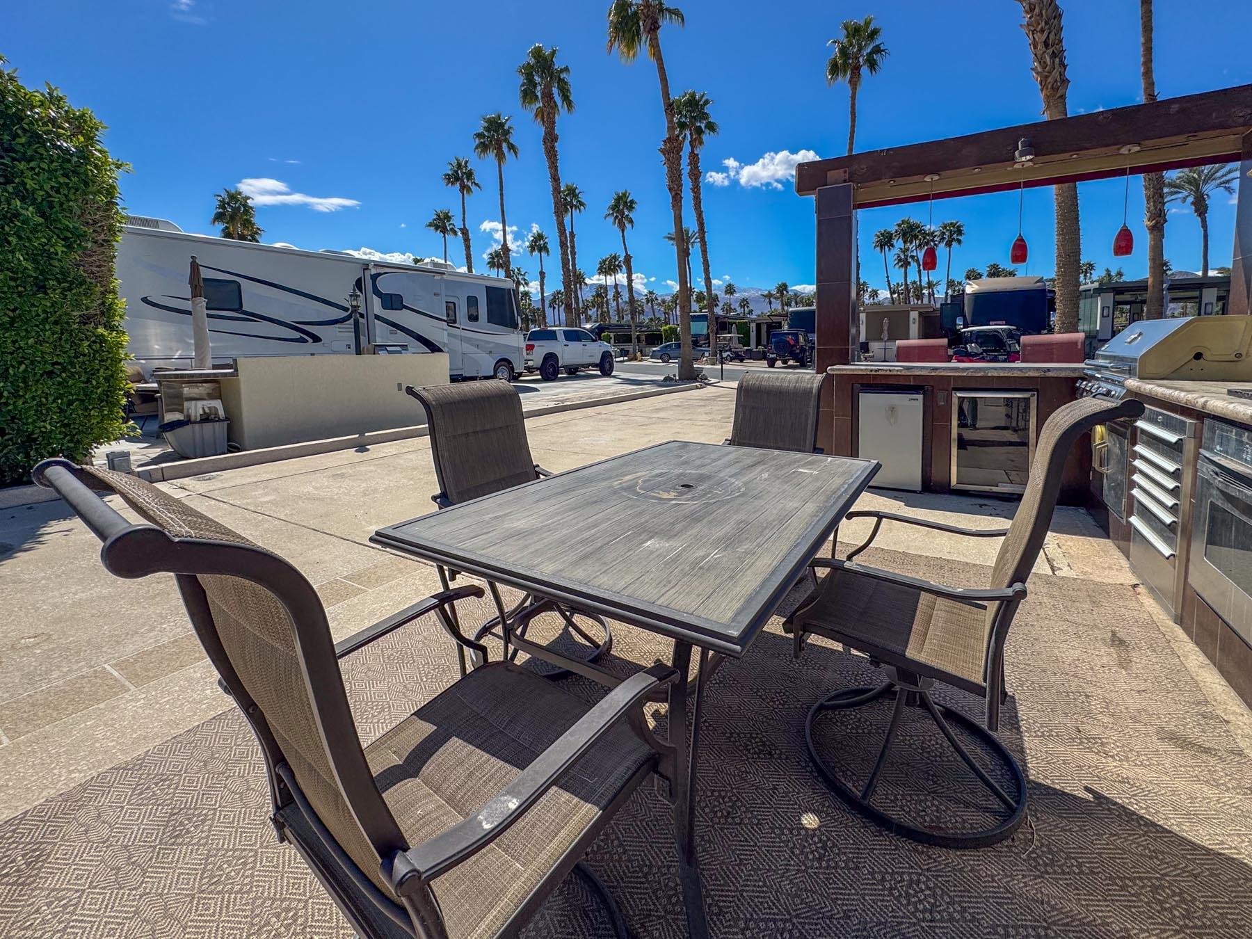 80394 Ave 48, Unit 68 Indio, CA 92201 - Photo 11 of 12 a view of a patio with a table and chairs