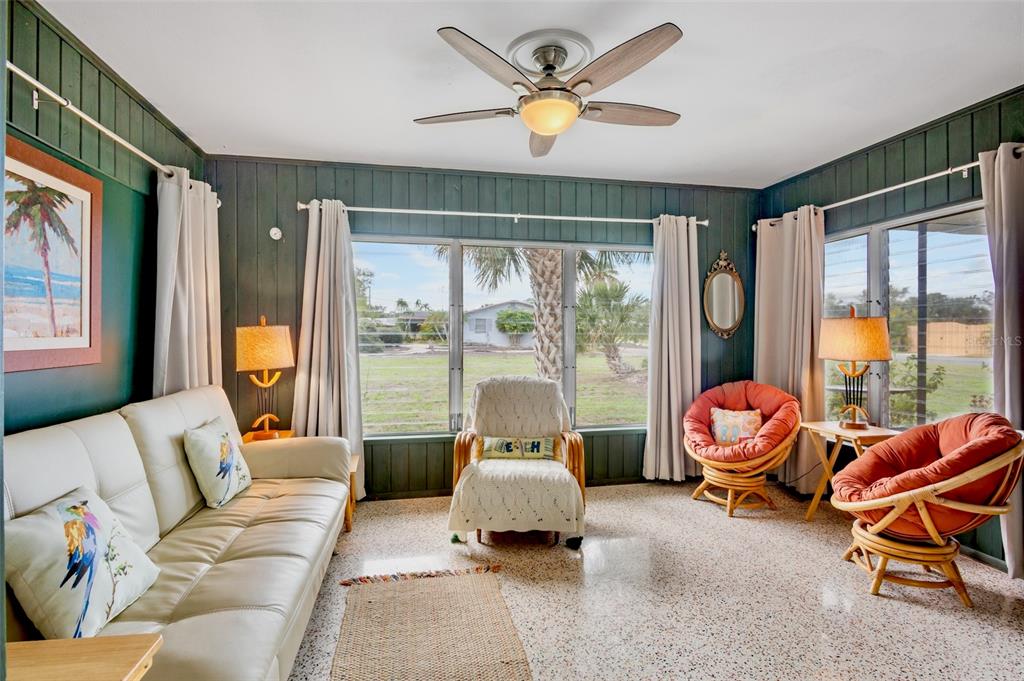 223 Roberts Road Nokomis, FL 34275 - Photo 13 of 27 a living room with furniture and a large window