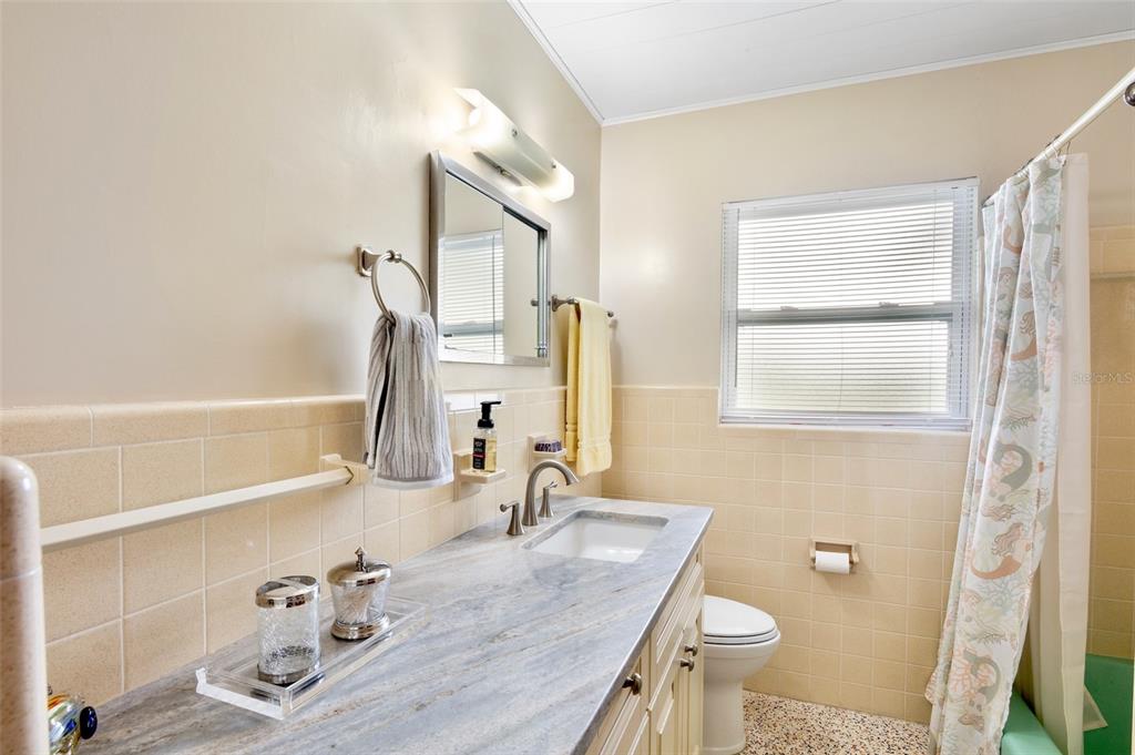 223 Roberts Road Nokomis, FL 34275 - Photo 21 of 27 a bathroom with a granite countertop sink and a mirror