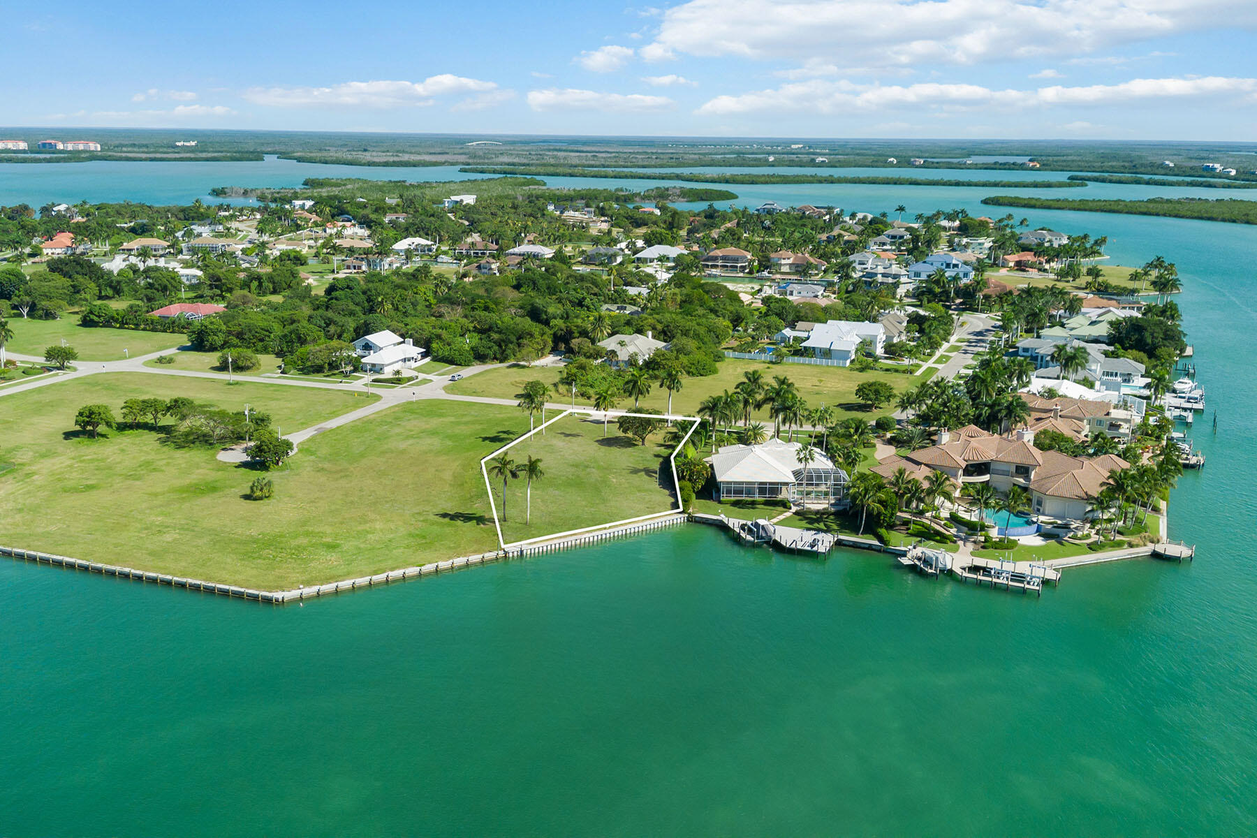 1028 West Inlet Drive Marco Island, FL 34145 - Photo 4 of 13 a view of a lake with a city
