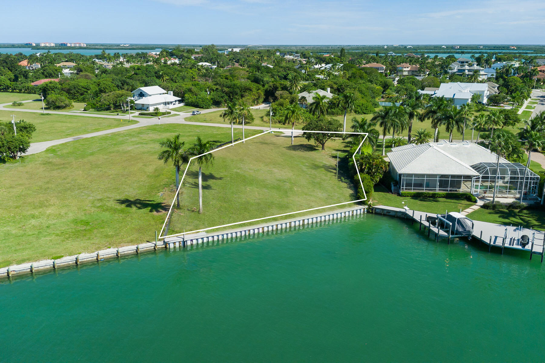 1028 West Inlet Drive Marco Island, FL 34145 - Photo 7 of 13 a view of a lake with a yard
