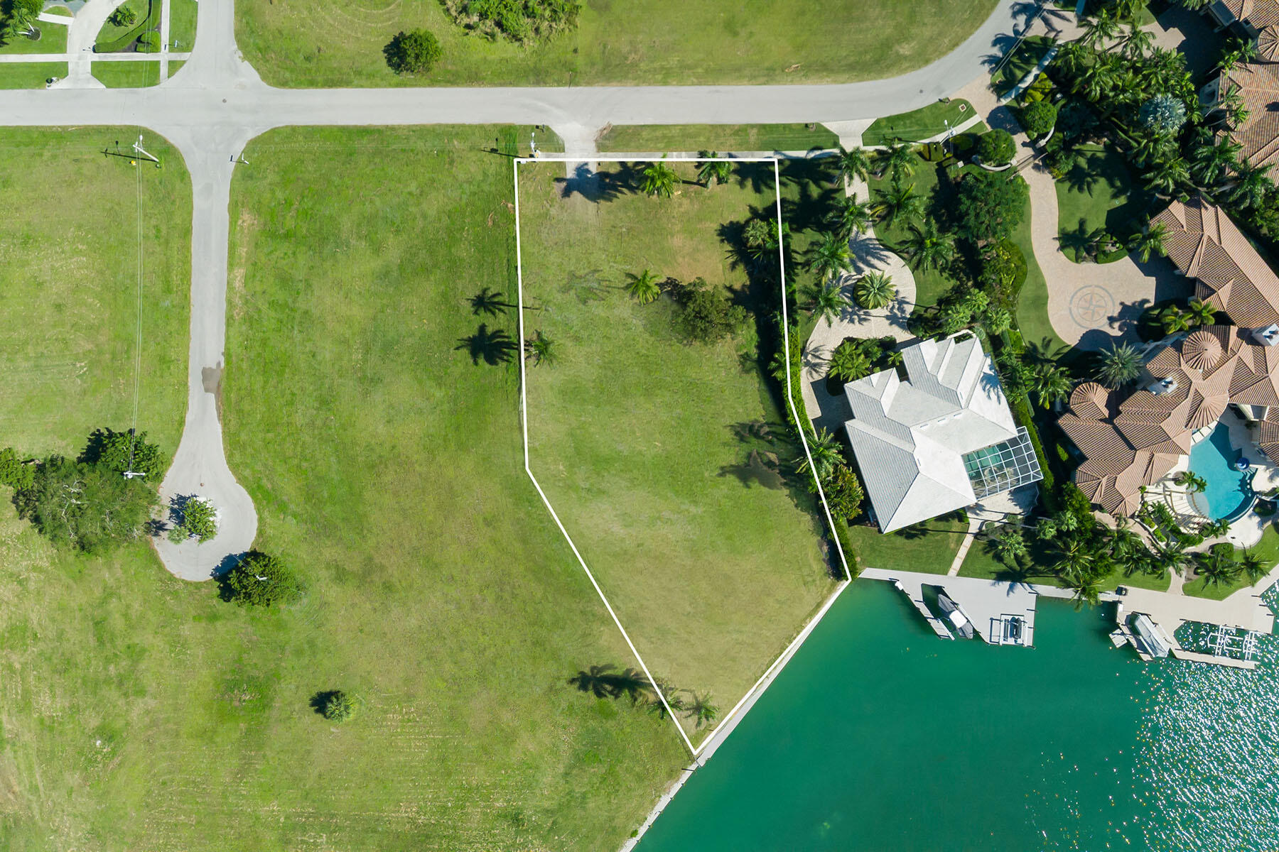 1028 West Inlet Drive Marco Island, FL 34145 - Photo 9 of 13 an aerial view of a residential houses with outdoor space and trees