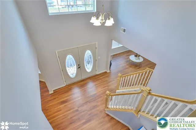 a living room with furniture and a ceiling fan