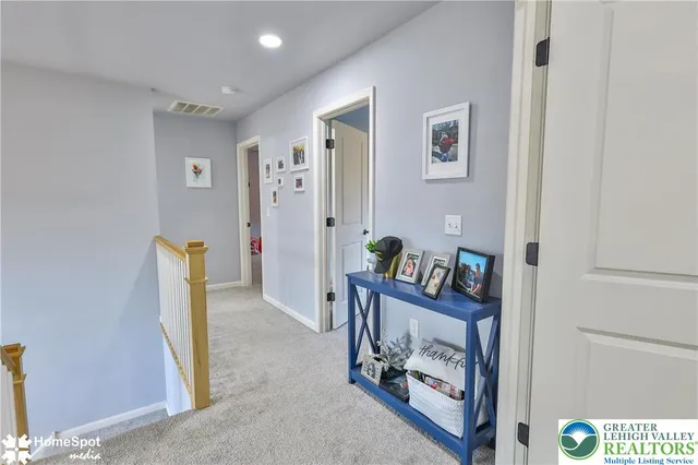 a work room with furniture and a flat screen tv