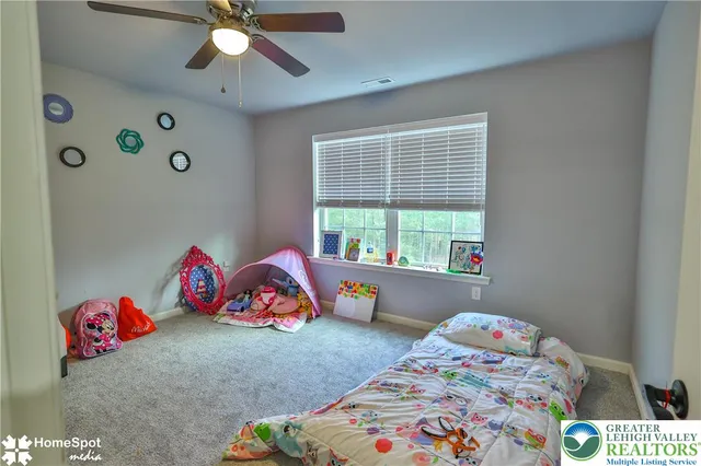 a bathroom with a sink a toilet a mirror a vanity and shower
