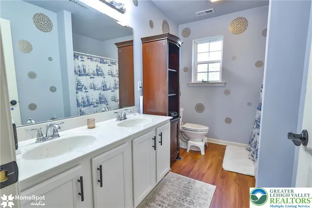 a bedroom with a bed and blue walls