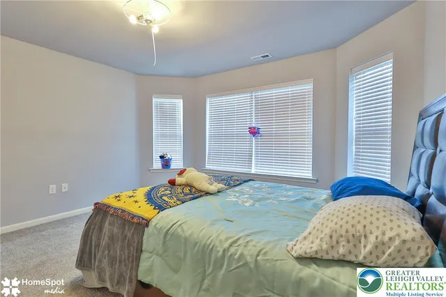 a front view of a house with a large window