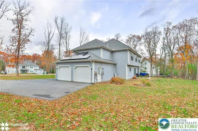 a house view with a sitting space and garden space
