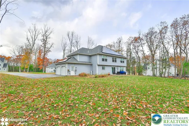 a view of outdoor sitting area with furniture and wooden floor
