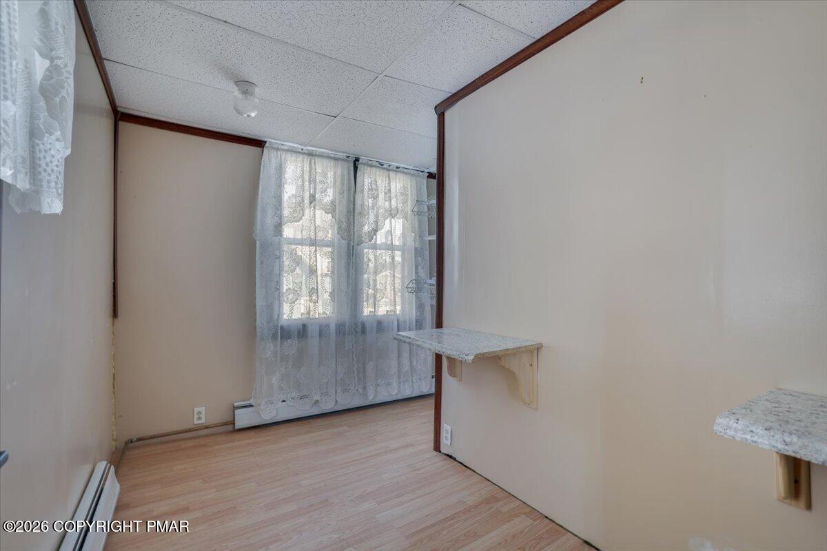402 Elizabeth Street Towanda, PA 18848 - Photo 12 of 30 a view of an empty room with wooden floor and a window