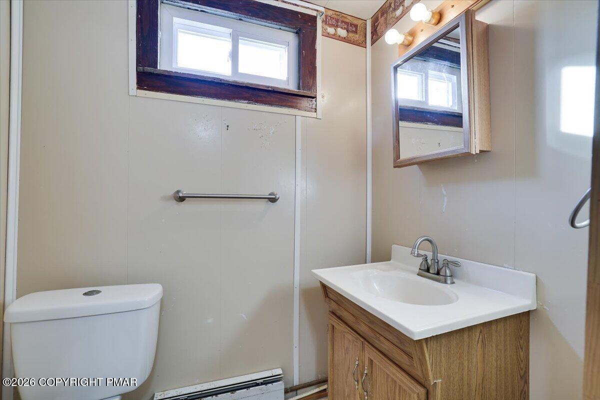 402 Elizabeth Street Towanda, PA 18848 - Photo 14 of 30 a bathroom with a sink a toilet and mirror