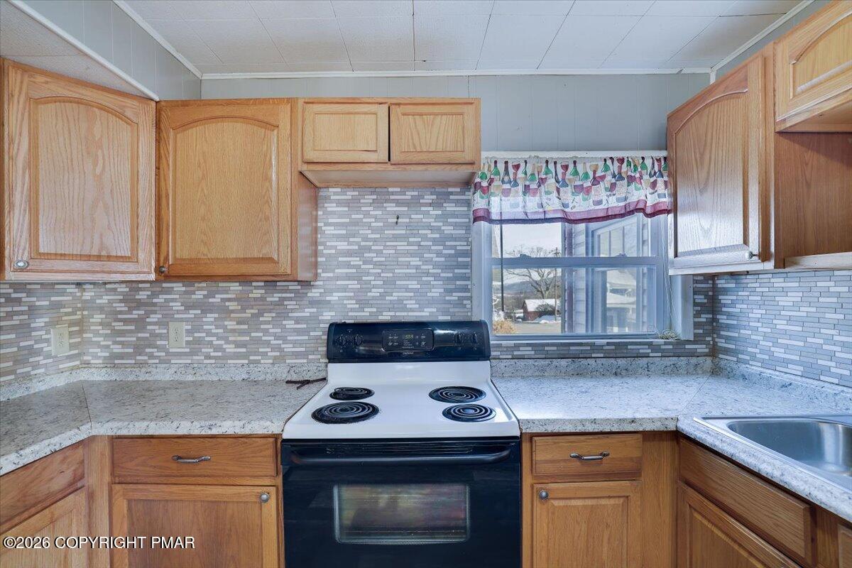 402 Elizabeth Street Towanda, PA 18848 - Photo 9 of 30 a kitchen with stainless steel appliances granite countertop a stove and a sink