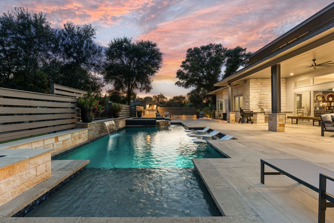 a view of swimming pool with chairs