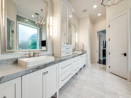 a bathroom with double sink and a mirror