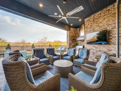 a outdoor living space with patio furniture and a fireplace
