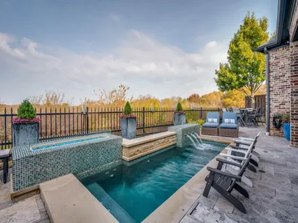 a view of a yard with furniture