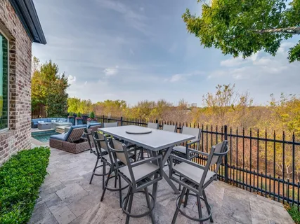 a view of a chairs and table on the terrace