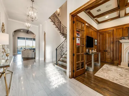 a view of a livingroom with furniture and staircase