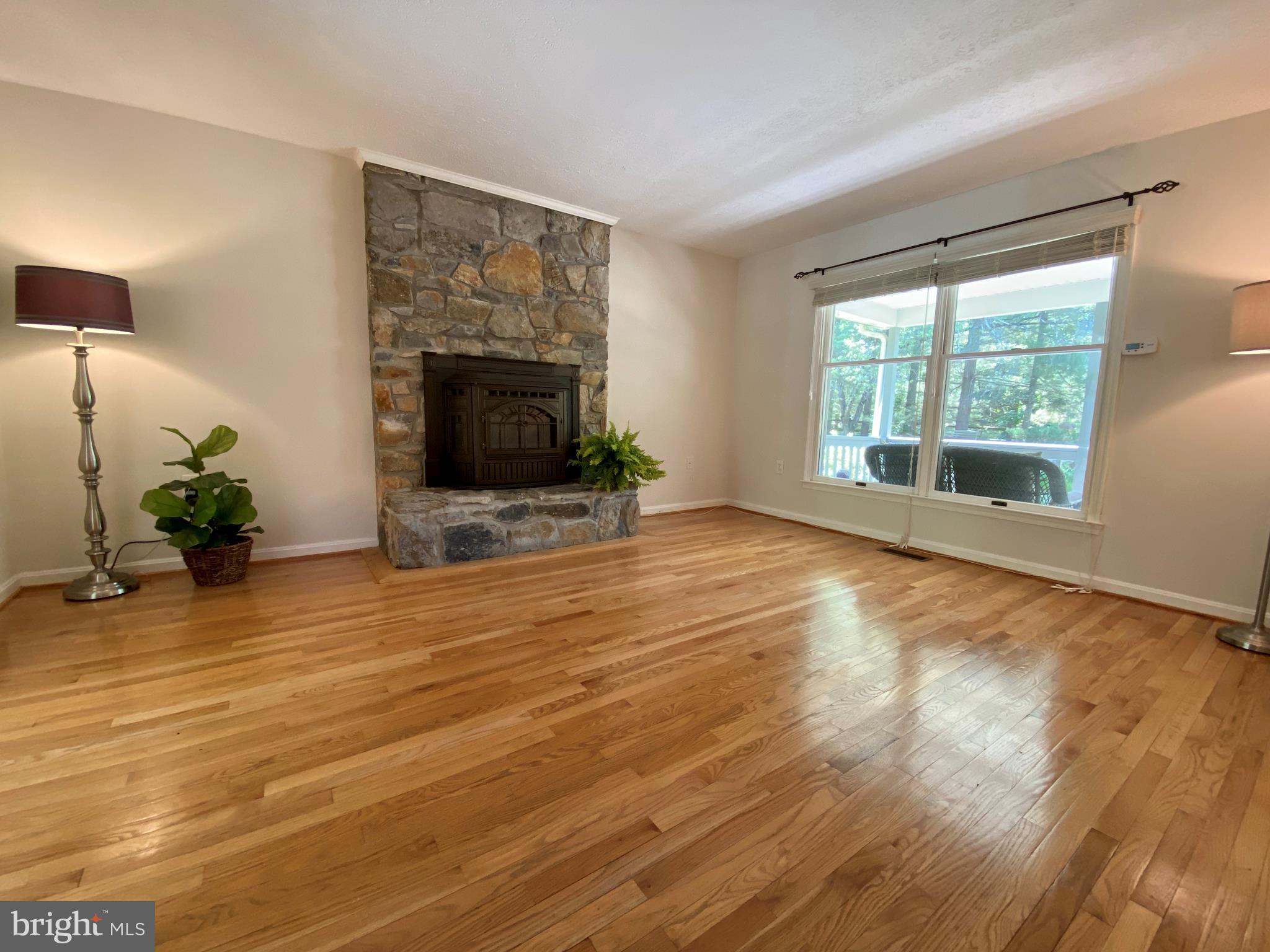 6799 Howellsville Road Boyce, VA 22620 - Photo 14 of 53 Family Room with Pellet Fireplace & Stone Surround
