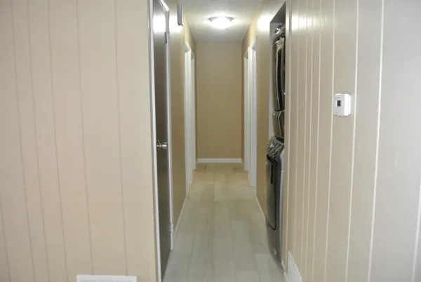 a bathroom with a glass shower door