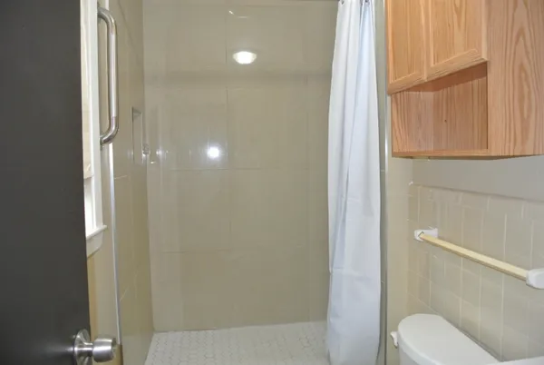 a bathroom with a sink and a shower curtain