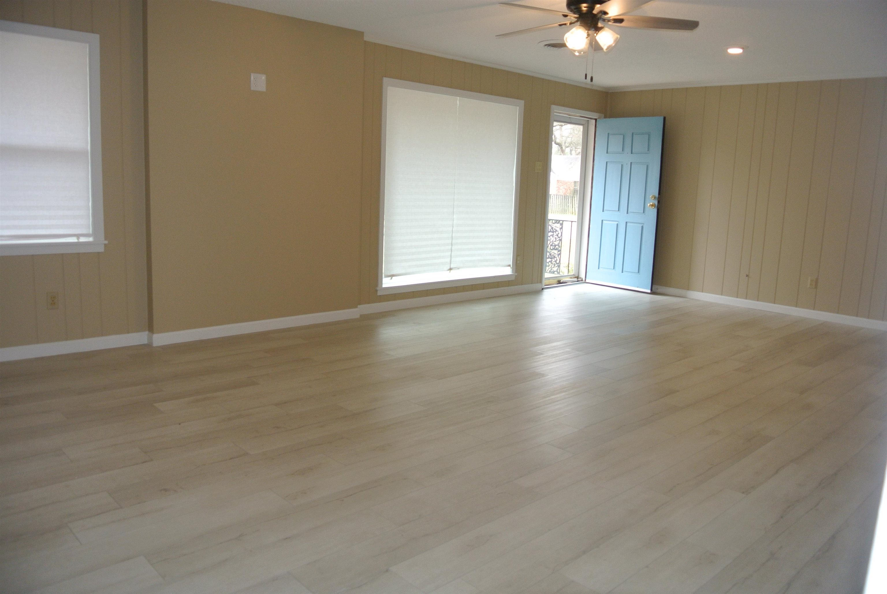 426 Cardinal Drive Collierville, TN 38017 - Photo 8 of 21 wooden floor in an empty room with a window
